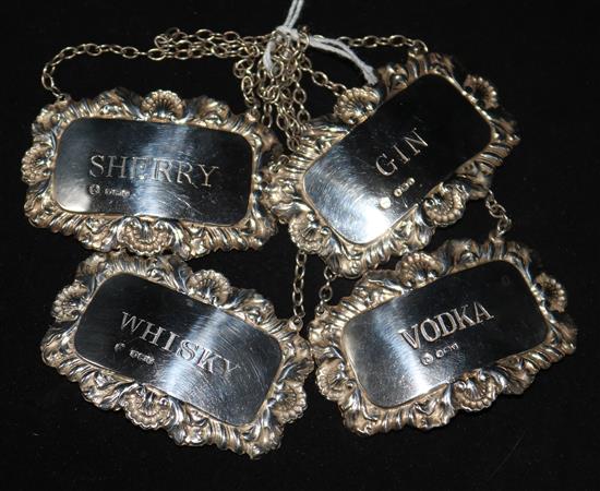 A set of four 1960s silver wine labels by Francis Howard Ltd, Sheffield, 1963/6.